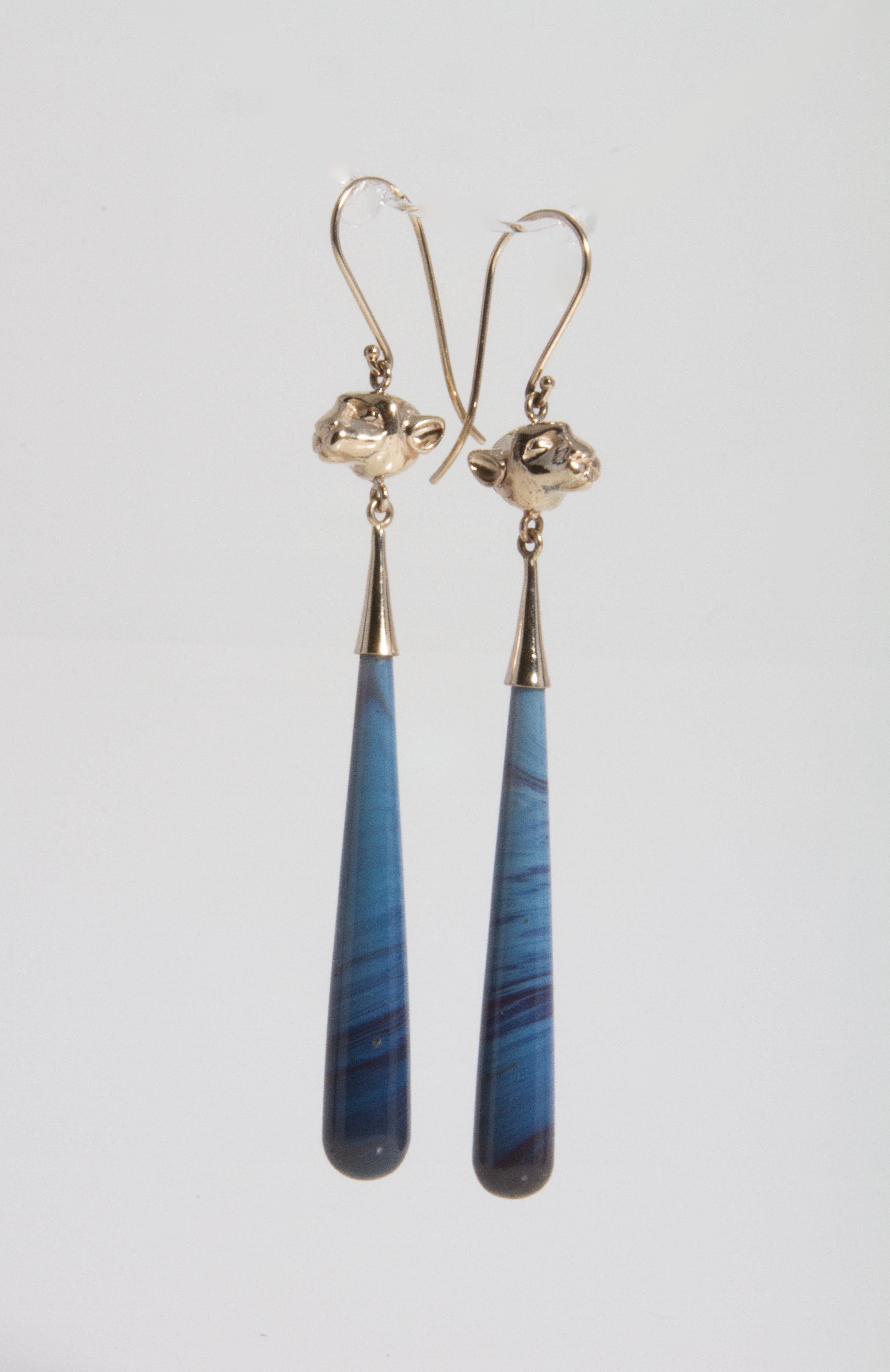 Lions head earrings with Blue Swirl Leland